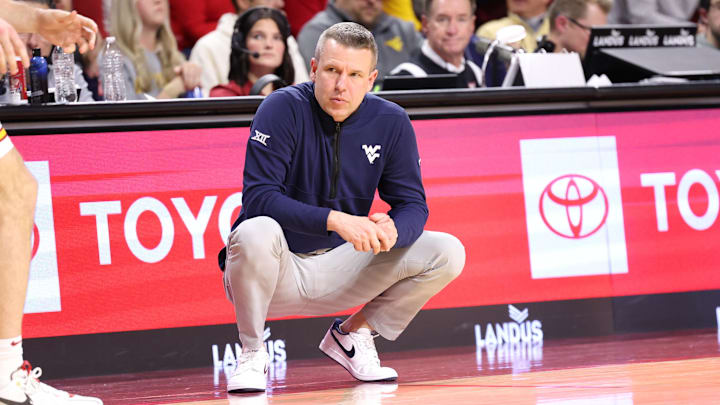 Jan 2, 2026; Ames, Iowa, USA; West Virginia Mountaineers head coach Ross Hodge watches his team play the Iowa State Cyclones during the second half at James H. Hilton Coliseum. Mandatory Credit: Reese Strickland-Imagn Images