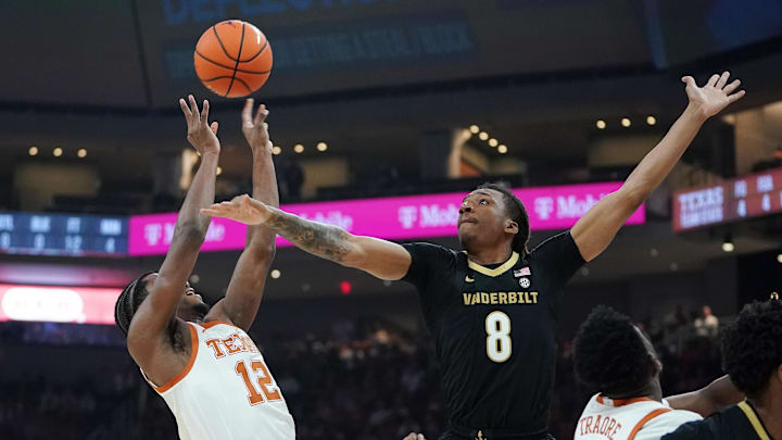 Jan 14, 2026; Austin, Texas, USA; Texas Longhorns guard Tramon Mark (12) shoots the ball against Vanderbilt Commodores forward Tyler Harris (8) during the first half at Moody Center. Mandatory Credit: Dustin Safranek-Imagn Images Jan 14, 2026; Austin, Texas, USA; Texas Longhorns guard Tramon Mark (12) shoots the ball against Vanderbilt Commodores forward Tyler Harris (8) during the first half at Moody Center. Mandatory Credit: Dustin Safranek-Imagn Images