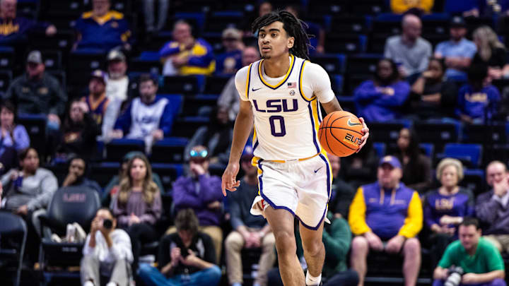 Feb 18, 2025; Baton Rouge, Louisiana, USA;  LSU Tigers guard Vyctorius Miller (0) dribbles against the South Carolina Gamecocks during the first half at Pete Maravich Assembly Center. Mandatory Credit: Stephen Lew-Imagn Images