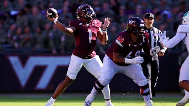 Sep 7, 2024; Blacksburg, Virginia, USA; Virginia Tech Hokies quarterback Kyron Drones (1) throws a pass during the first quarter against the Marshall Thundering Herd at Lane Stadium. Mandatory Credit: Peter Casey-Imagn Images