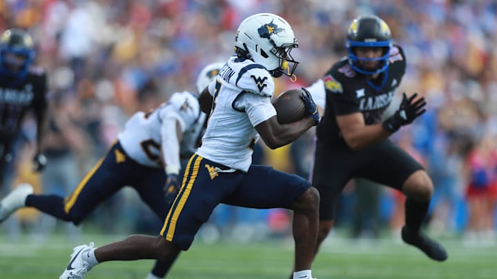 West Virginia Mountaineers wide receiver Oran Singleton Jr. (3) runs the ball during the first half of the game against Kansas Jayhawks at David Booth Kansas Memorial Stadium on Sept. 20, 2025.