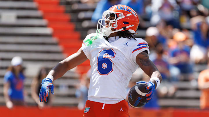 Apr 12, 2025; Gainesville, FL, USA; Florida Gators wide receiver Dallas Wilson (6) reacts after scoring a touchdown during the second half at Ben Hill Griffin Stadium. 