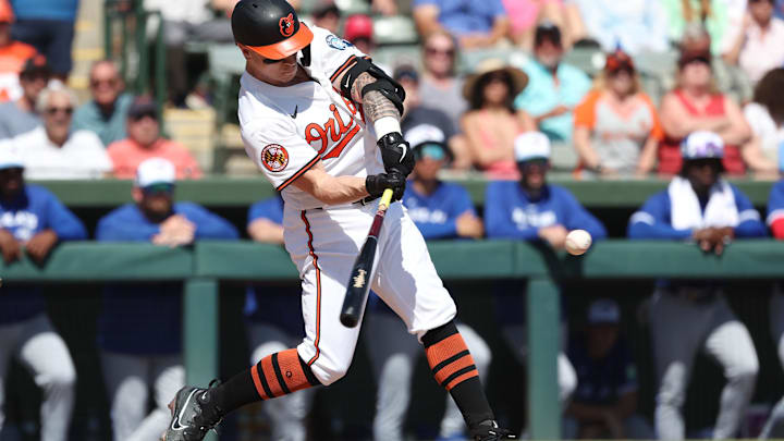  Baltimore Orioles outfielder Tyler O'Neill (9) hits a 3-run home run during the second inning against the Toronto Blue Jays at Ed Smith Stadium. 