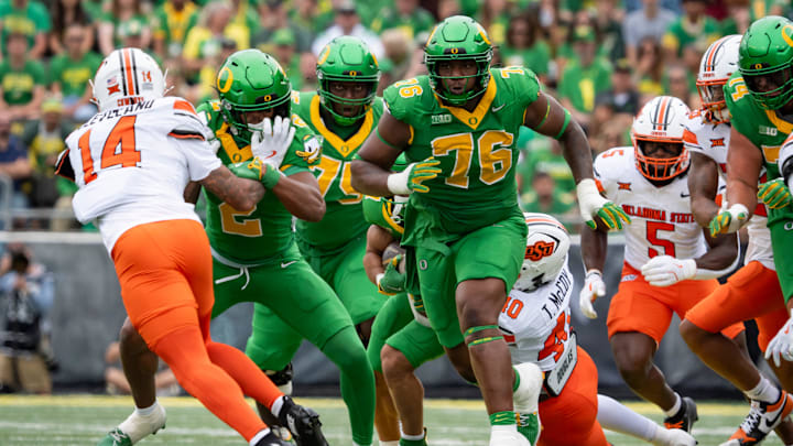 Oregon offensive lineman Isaiah World clears a path as the Oregon Ducks host the Oklahoma State Cowboys on Sept. 6, 2025, at Autzen Stadium in Eugene, Oregon.