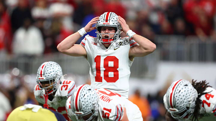 Jan 20, 2025; Atlanta, GA, USA; Ohio State Buckeyes quarterback Will Howard (18) calls a play against the Notre Dame Fighting Irish during the first half the CFP National Championship college football game at Mercedes-Benz Stadium. Mandatory Credit: Mark J. Rebilas-Imagn Images Jan 20, 2025; Atlanta, GA, USA; Ohio State Buckeyes quarterback Will Howard (18) calls a play against the Notre Dame Fighting Irish during the first half the CFP National Championship college football game at Mercedes-Benz Stadium. Mandatory Credit: Mark J. Rebilas-Imagn Images
