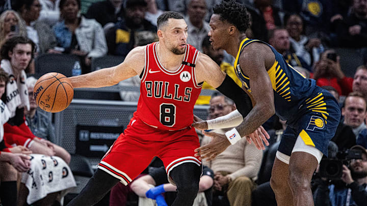 Jan 8, 2025; Indianapolis, Indiana, USA; Chicago Bulls guard Zach LaVine (8) dribbles the ball while Indiana Pacers guard Bennedict Mathurin (00) defends in the second half at Gainbridge Fieldhouse. Mandatory Credit: Trevor Ruszkowski-Imagn Images