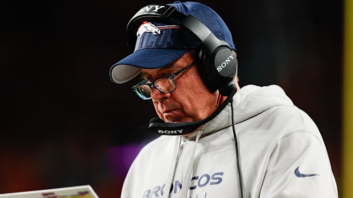 Sep 29, 2025; Denver, Colorado, USA; Denver Broncos head coach Sean Payton looks at his notes during the third quarter against the Cincinnati Bengals at Empower Field at Mile High. 