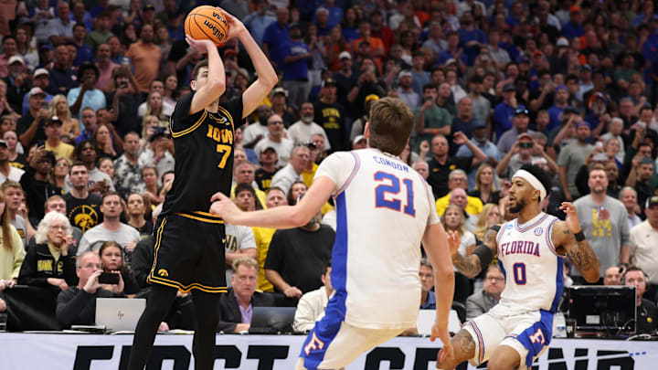 Mar 22, 2026; Tampa, FL, USA; Iowa Hawkeyes forward Alvaro Folgueiras (7) makes a go-ahead three-point basket against the Florida Gators late in the second half during a second round game of the men's 2026 NCAA Tournament at Benchmark International Arena. Mandatory Credit: Nathan Ray Seebeck-Imagn Images Mar 22, 2026; Tampa, FL, USA; Iowa Hawkeyes forward Alvaro Folgueiras (7) makes a go-ahead three-point basket against the Florida Gators late in the second half during a second round game of the men's 2026 NCAA Tournament at Benchmark International Arena. Mandatory Credit: Nathan Ray Seebeck-Imagn Images