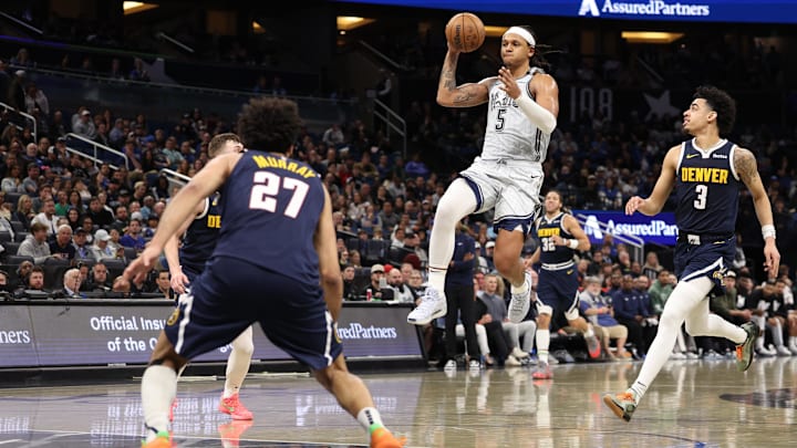 Orlando Magic forward Paolo Banchero (5) passes the ball against the Denver Nuggets in the fourth quarter at Kia Center.