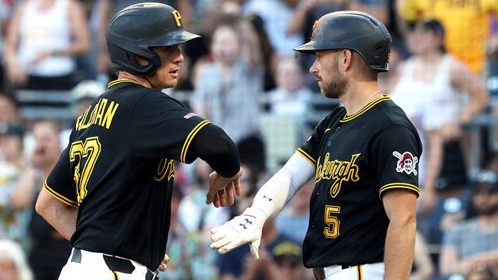 Jun 13, 2026; Pittsburgh, Pennsylvania, USA;  Pittsburgh Pirates right fielder Tyler Callihan (37) celebrates with second baseman Brandon Lowe (5) after Callihan scored a run against the Miami Marlins during the ninth inning at PNC Park. Mandatory Credit: Charles LeClaire-Imagn Images