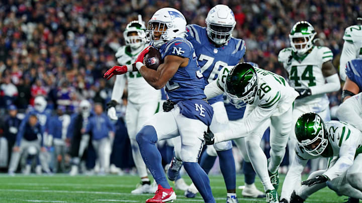 Nov 13, 2025; Foxborough, Massachusetts, USA; New England Patriots running back TreVeyon Henderson (32) celebrates after scoring a touchdown during the second half against the New York Jets at Gillette Stadium. Mandatory Credit: David Butler II-Imagn Images
