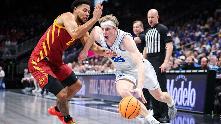 Brigham Young forward Richie Saunders (15) drives to the basket around Iowa State forward Joshua Jefferson (2) during the first half at T-Mobile Center in Thursday's Big 12 Tournament quarterfinals. Brigham Young forward Richie Saunders (15) drives to the basket around Iowa State forward Joshua Jefferson (2) during the first half at T-Mobile Center in Thursday's Big 12 Tournament quarterfinals.