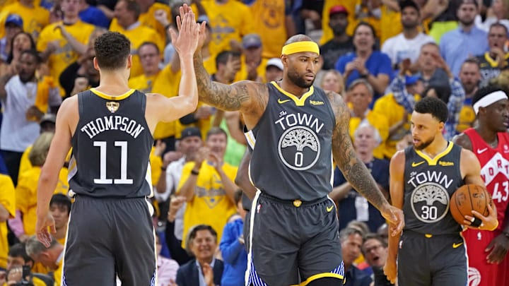 Jun 13, 2019; Oakland, CA, USA; Golden State Warriors center DeMarcus Cousins (0) celebrates with Golden State Warriors guard Klay Thompson (11) during the first quarter against the Toronto Raptors in game six of the 2019 NBA Finals at Oracle Arena.