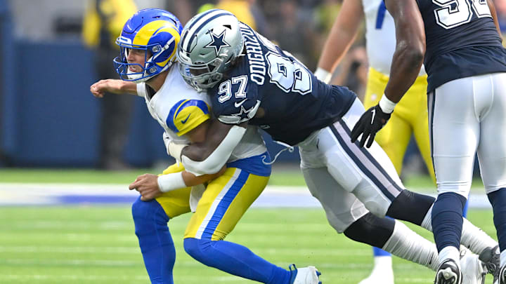 Dallas Cowboys defensive tackle Osa Odighizuwa pressures Los Angeles Rams quarterback Matthew Stafford to throw an incomplete pass in the second half at SoFi Stadium.