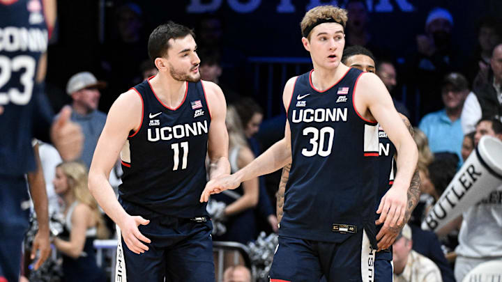Connecticut Huskies forward Alex Karaban (11) and forward Liam McNeeley (30)