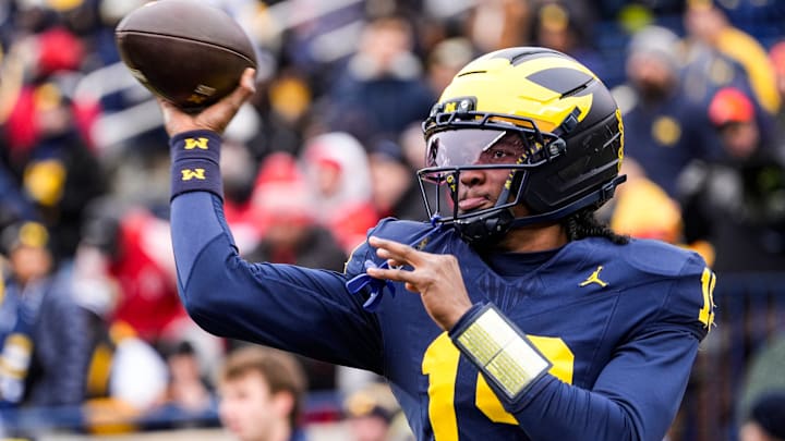 Michigan quarterback Bryce Underwood (19) warms up at Michigan Stadium in Ann Arbor on Saturday, Nov. 29, 2025.