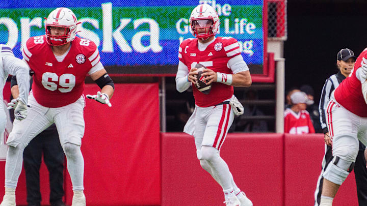 Oct 25, 2025; Lincoln, Nebraska, USA; Nebraska Cornhuskers quarterback Dylan Raiola (15) looks to throw a pass and offensive lineman Turner Corcoran (69) blocks against the Northwestern Wildcats during the third quarter at Memorial Stadium. Mandatory Credit: Dylan Widger-Imagn Images