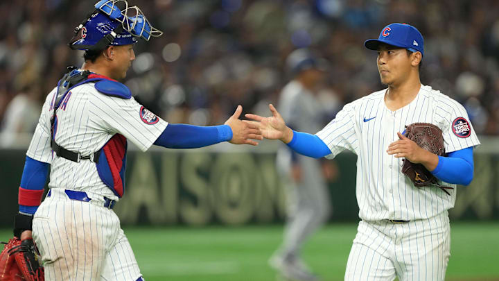 Mar 18, 2025; Bunkyo, Tokyo, JPN; Chicago Cubs starting pitcher Shota Imanaga (18) (right) shakes hands with catcher Miguel Amaya (9) (left) after the top of the second inning concludes against the Los Angeles Dodgers during the Tokyo Series at Tokyo Dome.