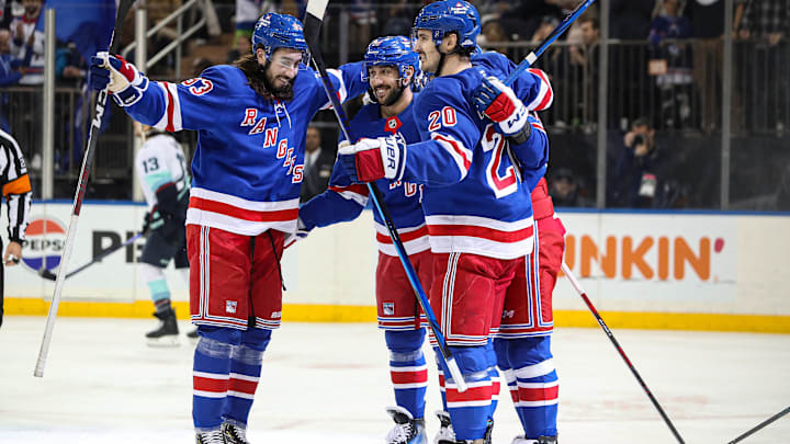 Dec 8, 2024; New York, New York, USA; New York Rangers center Vincent Trocheck (16) celebrates his power play goal with defenseman Adam Fox (23), left wing Chris Kreider (20) and left wing Artemi Panarin (10) during the second period against the Seattle Kraken at Madison Square Garden. Mandatory Credit: Danny Wild-Imagn Images