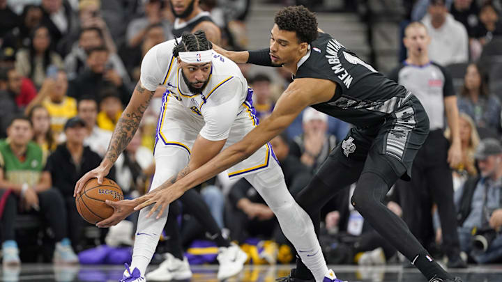 Nov 15, 2024; San Antonio, Texas, USA; Los Angeles Lakers center Anthony Davis (3) looks to pass the ball while defended by San Antonio Spurs center Victor Wembanyama (1) during the first half during the first half at Frost Bank Center. Mandatory Credit: Scott Wachter-Imagn Images Nov 15, 2024; San Antonio, Texas, USA; Los Angeles Lakers center Anthony Davis (3) looks to pass the ball while defended by San Antonio Spurs center Victor Wembanyama (1) during the first half during the first half at Frost Bank Center. Mandatory Credit: Scott Wachter-Imagn Images