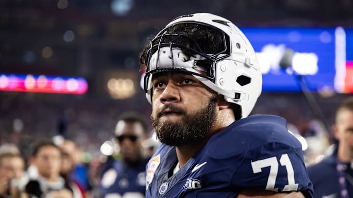Dec 31, 2024; Glendale, AZ, USA; Penn State Nittany Lions offensive lineman Olaivavega Ioane (71) against the Boise State Broncos during the Fiesta Bowl at State Farm Stadium. Mandatory Credit: Mark J. Rebilas-Imagn Images