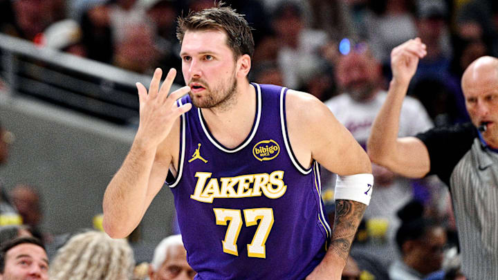 Los Angeles Lakers guard Luka Doncic (77) celebrates a three point shot during the second quarter against the Indiana Pacers at Gainbridge Fieldhouse. Mandatory Credit: Marc Lebryk-Imagn Images