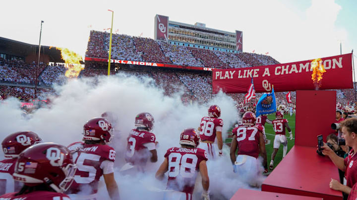 Oklahoma's players take the field at Gaylord Family-Oklahoma Memorial Stadium.