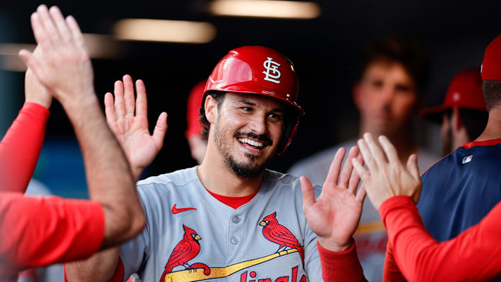Jul 21, 2025; Denver, Colorado, USA; St. Louis Cardinals third baseman Nolan Arenado (28) celebrates in the dugout after scoring on an RBI in the fourth inning against the Colorado Rockies at Coors Field. Mandatory Credit: Isaiah J. Downing-Imagn Images