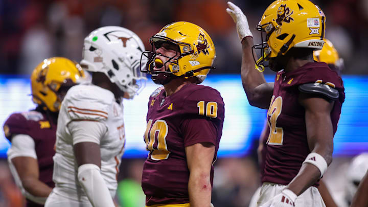 Arizona State Sun Devils quarterback Sam Leavitt (10) reacts after a run against the Texas Longhorns in overtime of the Peach Bowl.