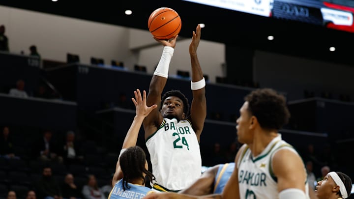 Dec 21, 2025; Waco, Texas, USA; Baylor Bears guard Tounde Yessoufou (24) scores a basket against Southern University Jaguars guard Cam Amboree (3) during the first half at Paul and Alejandra Foster Pavilion. Mandatory Credit: Chris Jones-Imagn Images