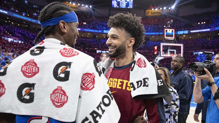 May 18, 2025; Oklahoma City, Oklahoma, USA; Denver Nuggets guard Jamal Murray (27) and Oklahoma City Thunder guard Shai Gilgeous-Alexander (2) hug after their game seven of the second round for the 2025 NBA Playoffs at Paycom Center. Mandatory Credit: Alonzo Adams-Imagn Images