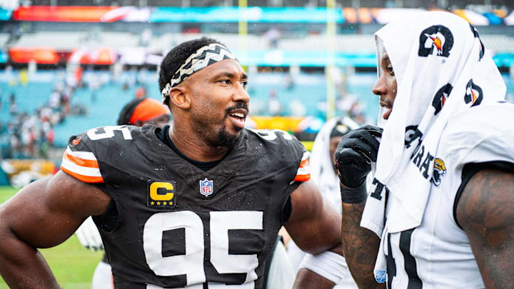 Sep 15, 2024; Jacksonville, Florida, USA; Cleveland Browns defensive end Myles Garrett (95) talks with Jacksonville Jaguars defensive end Josh Hines-Allen (41) after a game at EverBank Stadium. 