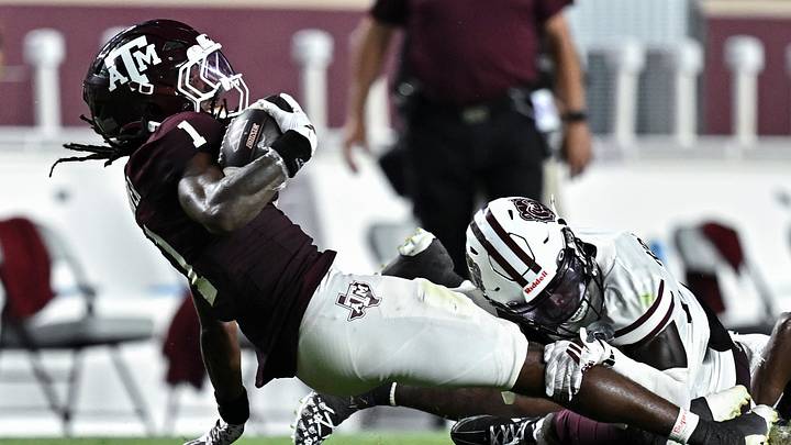 Sep 5, 2026; College Station, Texas, USA; Texas A&M Aggies wide receiver Mario Craver (1) is tackle by Missouri State Bears cornerback Joel Kpassou (8) during the second half at Kyle Field. Mandatory Credit: Maria Lysaker-Imagn Images Sep 5, 2026; College Station, Texas, USA; Texas A&M Aggies wide receiver Mario Craver (1) is tackle by Missouri State Bears cornerback Joel Kpassou (8) during the second half at Kyle Field. Mandatory Credit: Maria Lysaker-Imagn Images