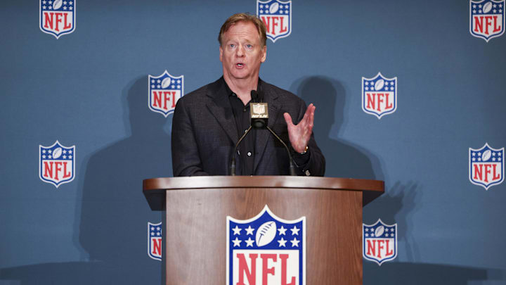 Roger Goodell speaks to media at an NFL podium.