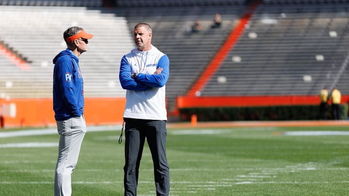 Apr 12, 2025; Gainesville, FL, USA; Florida Gators athletic director Scott Stricklin and Florida Gators head coach Billy Napier talk before the game at Ben Hill Griffin Stadium. Mandatory Credit: Matt Pendleton-Imagn Images