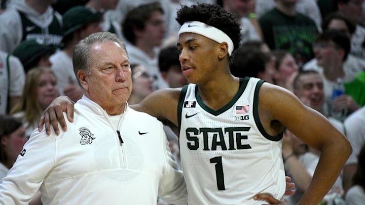 Mar 9, 2025; East Lansing, Michigan, USA; Michigan State Spartans head coach Tom Izzo huddles with Michigan State Spartans guard Jeremy Fears Jr. (1) during the second half against the Michigan Wolverines at Jack Breslin Student Events Center. Mandatory Credit: Dale Young-Imagn Images Mar 9, 2025; East Lansing, Michigan, USA; Michigan State Spartans head coach Tom Izzo huddles with Michigan State Spartans guard Jeremy Fears Jr. (1) during the second half against the Michigan Wolverines at Jack Breslin Student Events Center. Mandatory Credit: Dale Young-Imagn Images