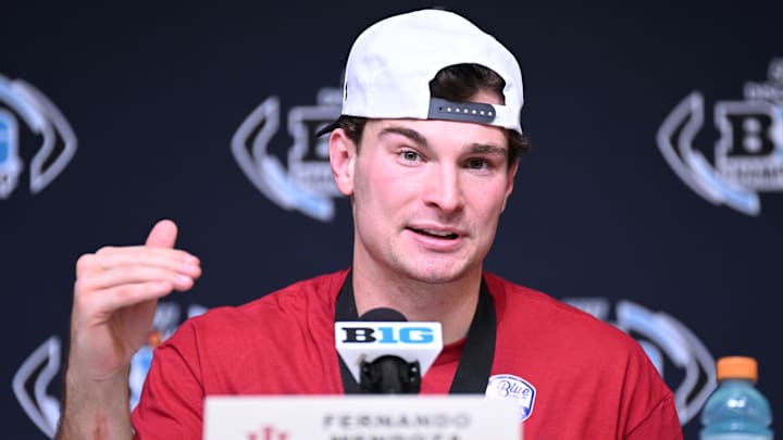 Dec 6, 2025; Indianapolis, IN, USA; Indiana Hoosiers quarterback Fernando Mendoza (15) speaks in a press conference after defeating the Ohio State Buckeyes in the Big Ten Championship. Dec 6, 2025; Indianapolis, IN, USA; Indiana Hoosiers quarterback Fernando Mendoza (15) speaks in a press conference after defeating the Ohio State Buckeyes in the Big Ten Championship.
