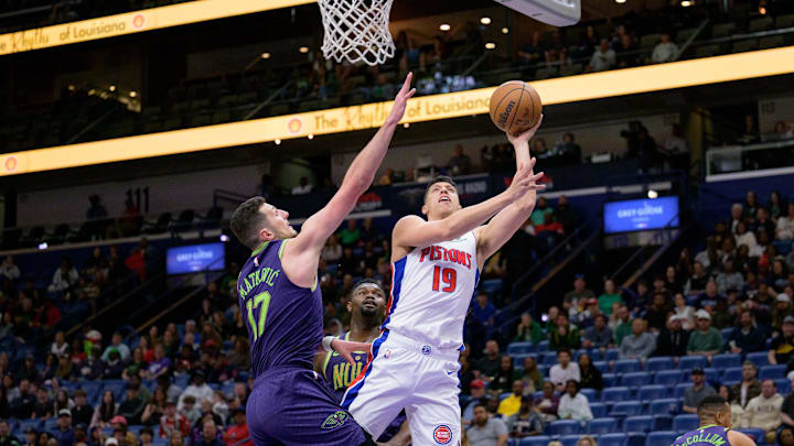 Mar 17, 2025; New Orleans, Louisiana, USA; Detroit Pistons forward Simone Fontecchio (19) shoots against New Orleans Pelicans center Karlo Matkovic (17) during the first half at Smoothie King Center. Mandatory Credit: Matthew Hinton-Imagn Images