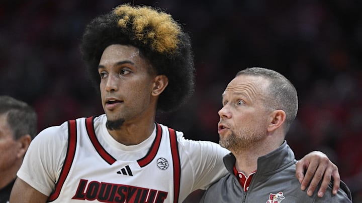 Dec 11, 2024; Louisville, Kentucky, USA;  Louisville Cardinals head coach Pat Kelsey talks with guard Chucky Hepburn (24) during the second half against the UTEP Miners at KFC Yum! Center. Louisville defeated Texas-El Paso 77-74. 