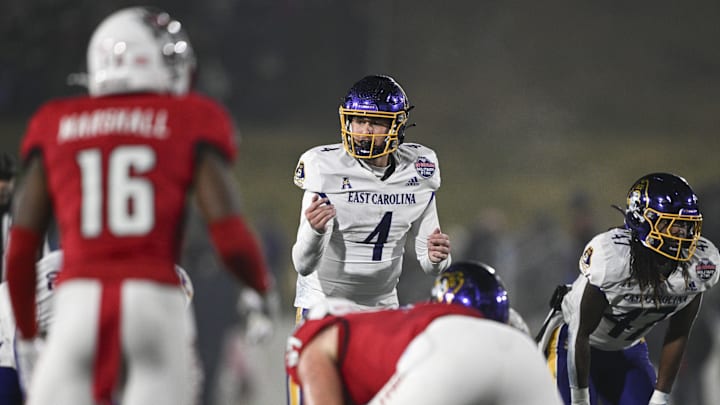 Dec 28, 2024; Annapolis, MD, USA;  East Carolina Pirates quarterback Katin Houser (4) calls a play act the line during first half of the Go Bowling Military Bowl against the North Carolina State Wolfpack at Navy-Marine Corps Memorial Stadium. Mandatory Credit: Tommy Gilligan-Imagn Images