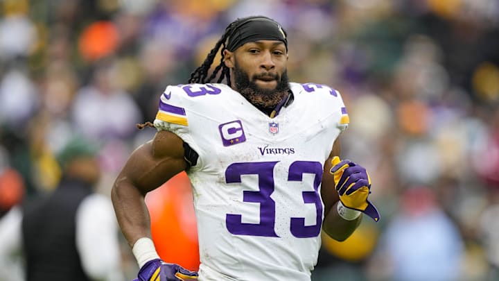 Nov 23, 2025; Green Bay, Wisconsin, USA;  Minnesota Vikings running back Aaron Jones Sr. (33) during the game against the Green Bay Packers at Lambeau Field. Mandatory Credit: Jeff Hanisch-Imagn Images