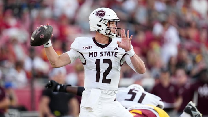 Aug 30, 2025; Los Angeles, California, USA; Missouri State Bears quarterback Jacob Clark (12) throws the ball against the Southern California Trojans in the second half at United Airlines Field at Los Angeles Memorial Coliseum. Mandatory Credit: Kirby Lee-Imagn Images