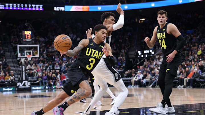 Oct 31, 2024; Salt Lake City, Utah, USA; Utah Jazz guard Keyonte George (3) drives against San Antonio Spurs center Victor Wembanyama (1) during the third quarter at Delta Center. Mandatory Credit: Rob Gray-Imagn Images