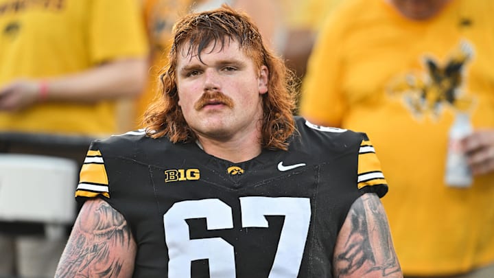 Sep 13, 2025; Iowa City, Iowa, USA; Iowa Hawkeyes offensive lineman Gennings Dunker (67) looks on before the game against the Massachusetts Minutemen at Kinnick Stadium. Mandatory Credit: Jeffrey Becker-Imagn Images