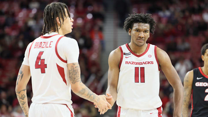 Jan 22, 2025; Fayetteville, Arkansas, USA; Arkansas Razorbacks forwards Trevon Brazile (4) and Karter Knox (4) celebrate after a play int he second half against the Georgia Bulldogs at Bud Walton Arena. Arkansas won 68-65. Mandatory Credit: Nelson Chenault-Imagn Images
