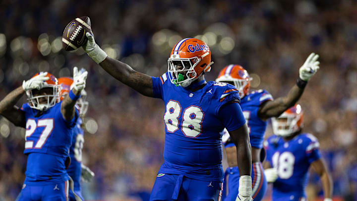 Nov 16, 2024; Gainesville, Florida, USA; Florida Gators defensive lineman Caleb Banks (88) celebrates with the ball after a fumble recovery against the LSU Tigers during the second half at Ben Hill Griffin Stadium. Mandatory Credit: Matt Pendleton-Imagn Images