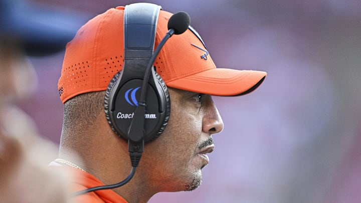 Oct 4, 2025; Louisville, Kentucky, USA; Virginia Cavaliers head coach Tony Elliott watches from the sideline during the second half against the Louisville Cardinals at L&N Federal Credit Union Stadium. Virginia defeated Louisville 30-27. Mandatory Credit: Jamie Rhodes-Imagn Images