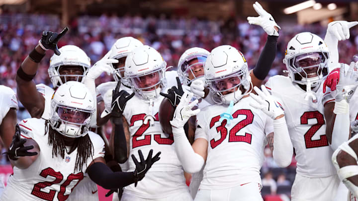Dec 15, 2024; Glendale, Arizona, USA; Arizona Cardinals cornerback Sean Murphy-Bunting (23) celebrates an interception with teammates against the New England Patriots during the second half at State Farm Stadium. Mandatory Credit: Joe Camporeale-Imagn Images