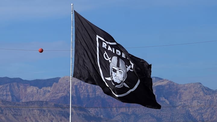 Nov 24, 2024; Paradise, Nevada, USA; A Las Vegas Raiders flag near Allegiant Stadium. Mandatory Credit: Kirby Lee-Imagn Images