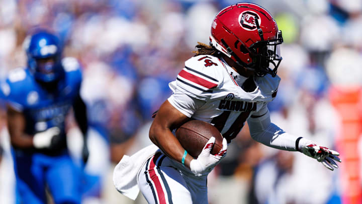 Sep 7, 2024; Lexington, Kentucky, USA; South Carolina Gamecocks wide receiver Jared Brown (14) runs the ball during the first quarter against the Kentucky Wildcats at Kroger Field. Mandatory Credit: Jordan Prather-Imagn Images